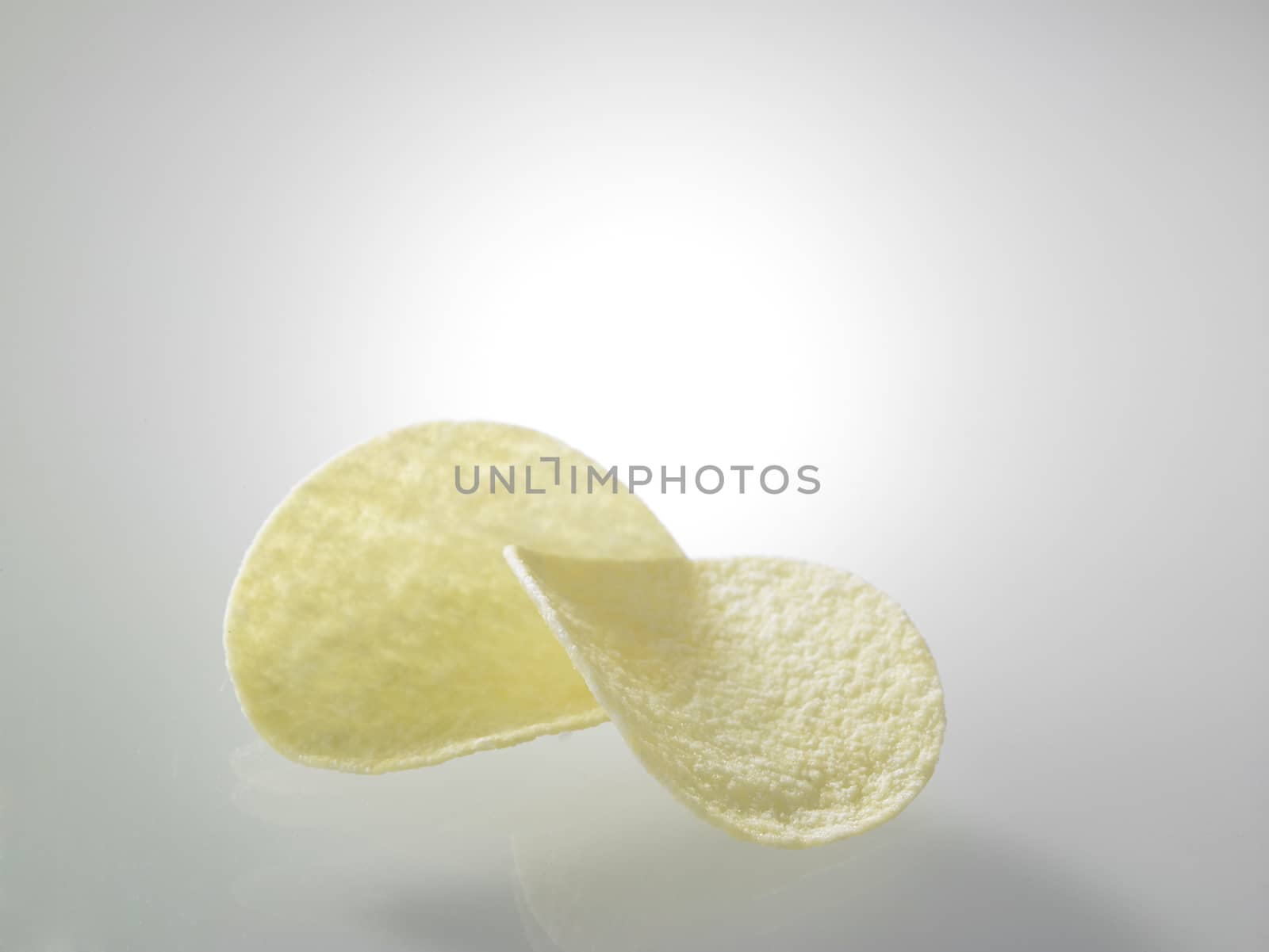 Potato chips on top of glass table