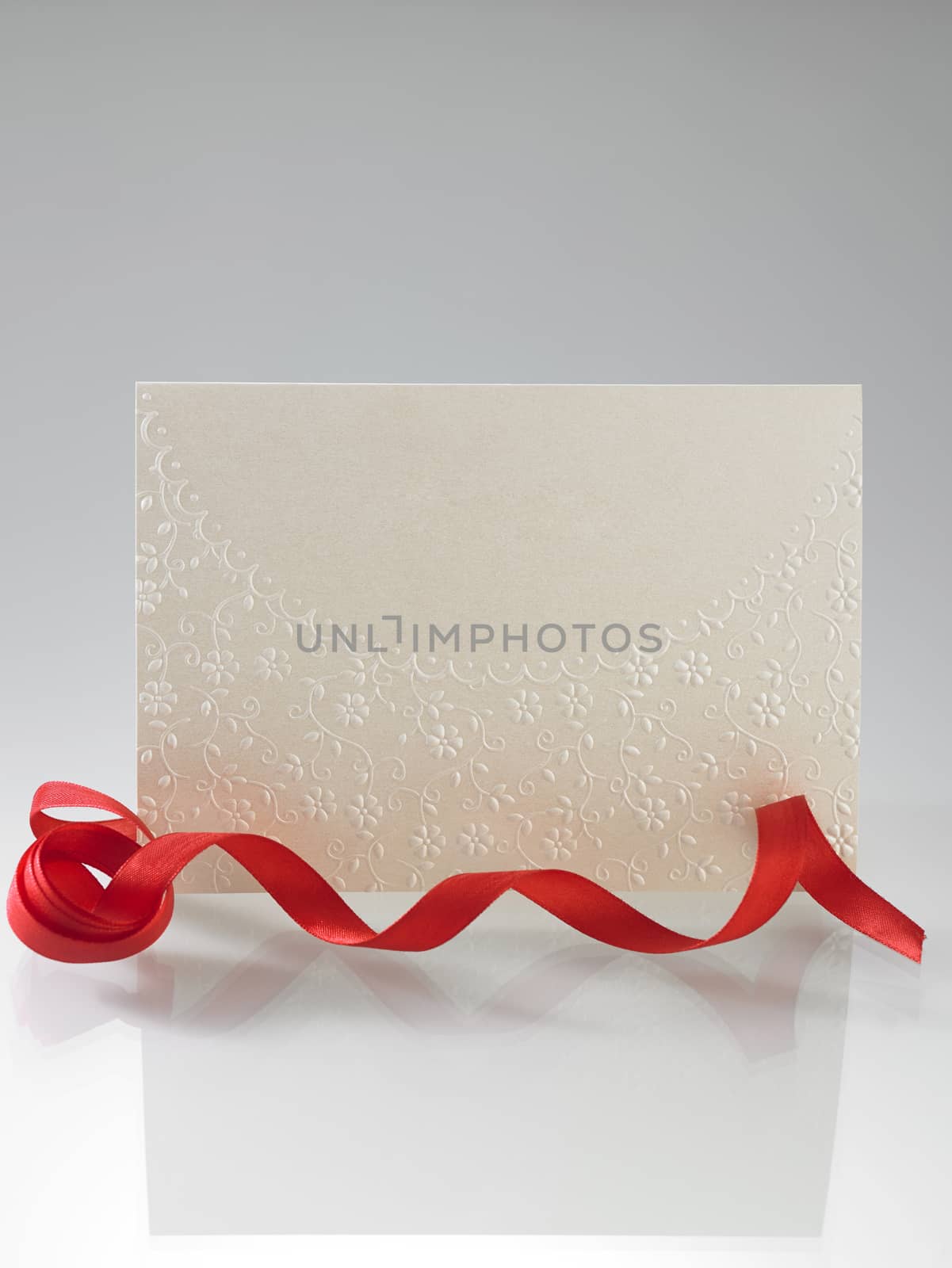 blank greeting card with red ribbon