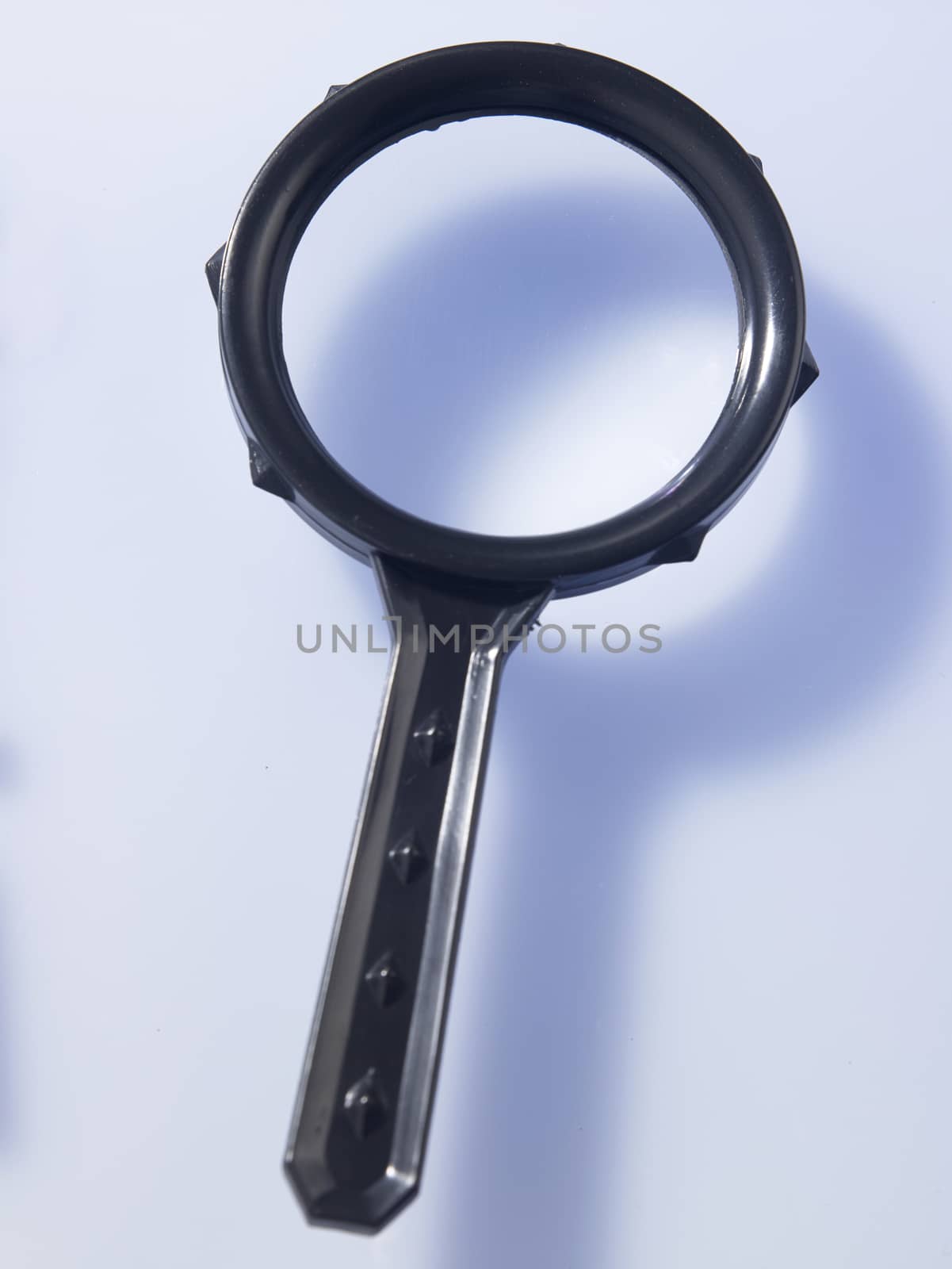 Magnifying glass on top of glass table