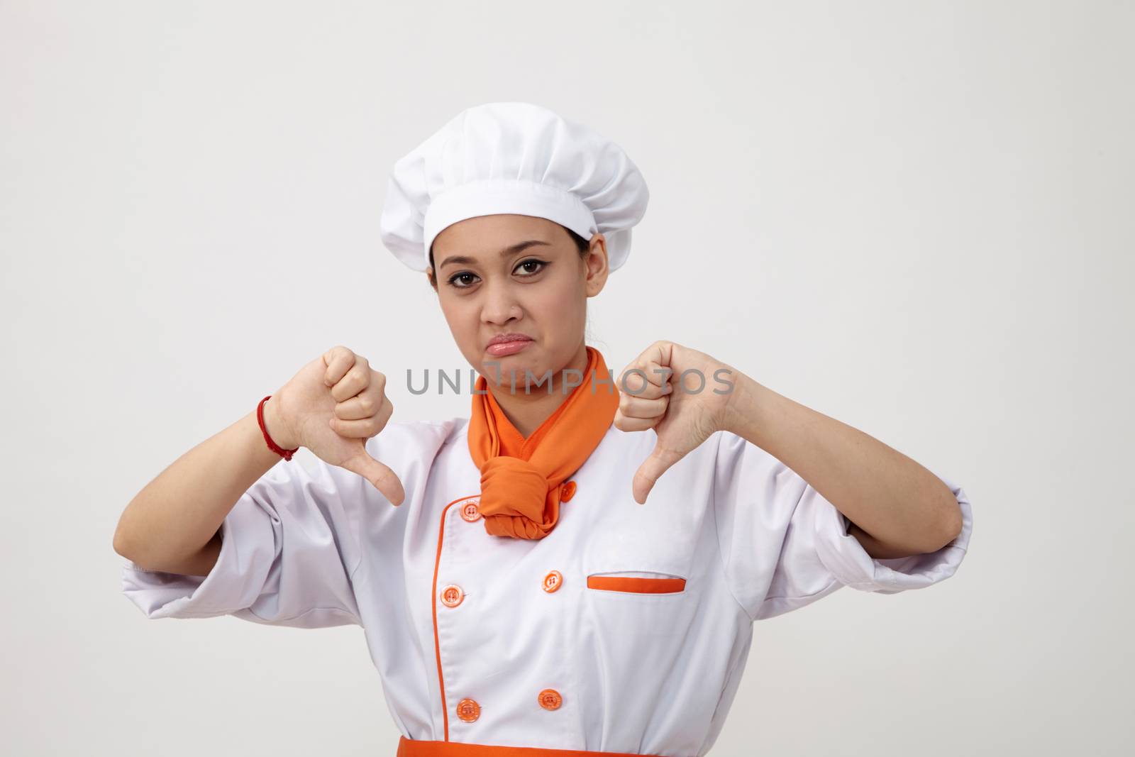 woman chef sad expression with thumb down