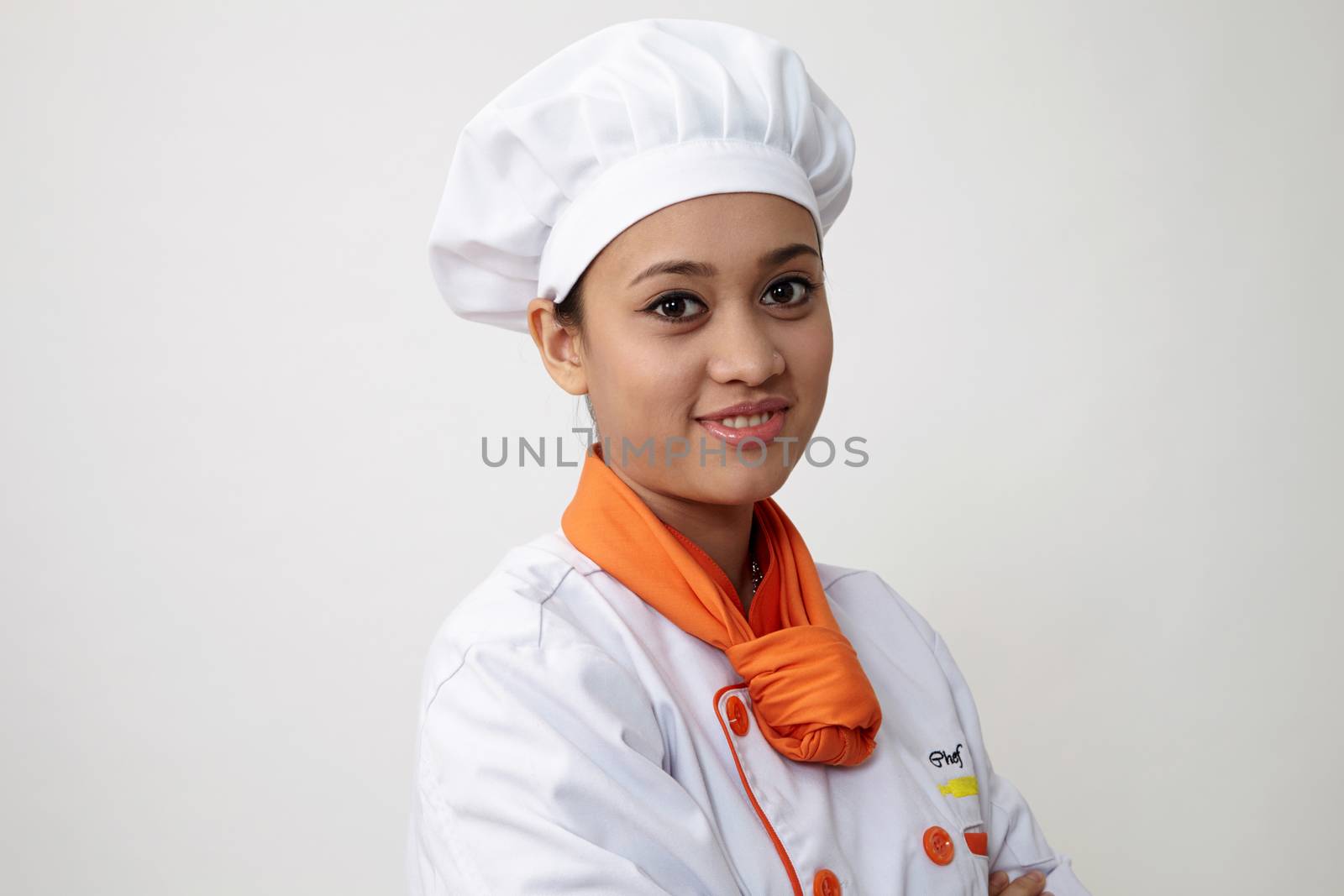 Portrait of a Indian woman with chef uniform with confident
