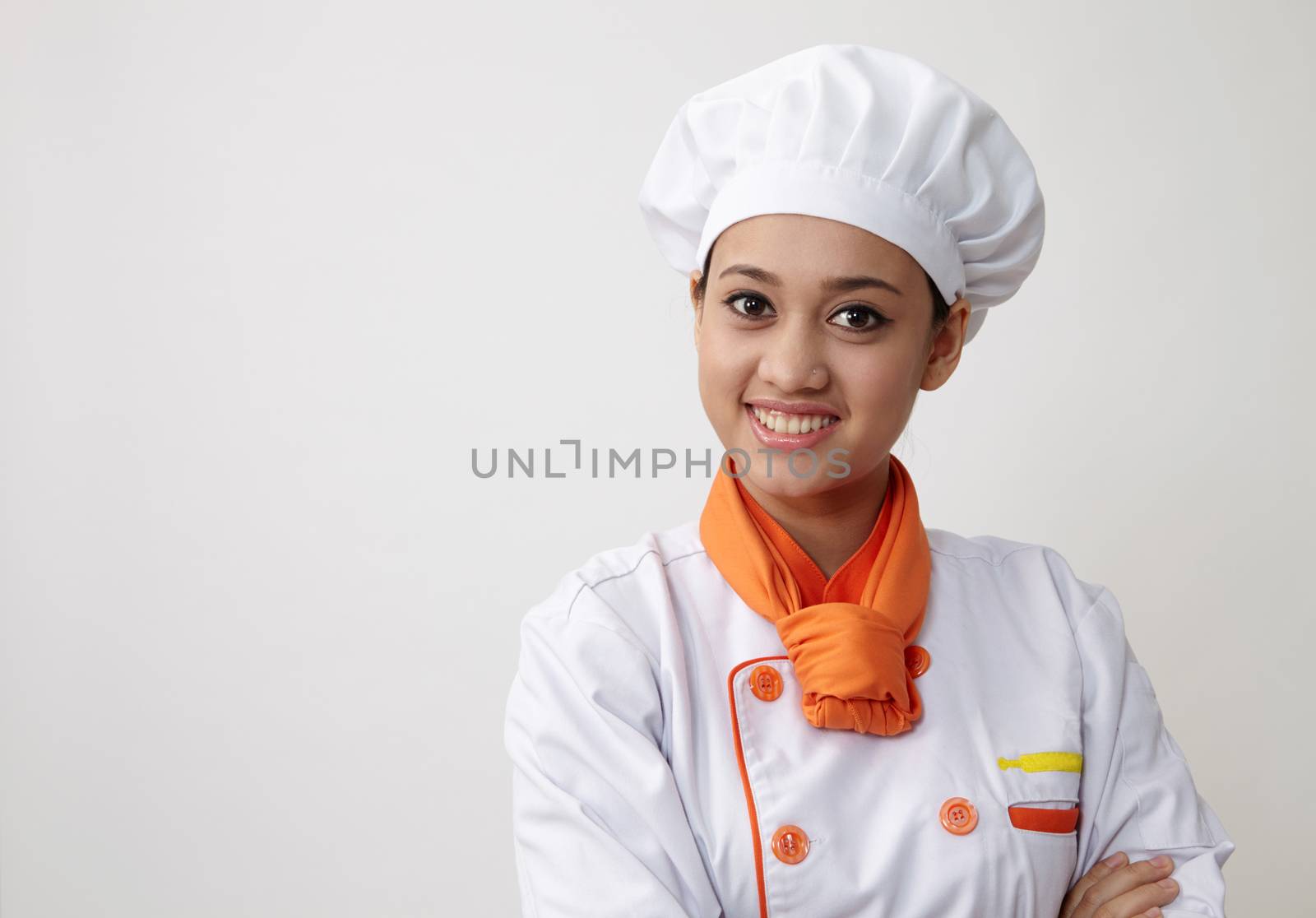 Portrait of a Indian woman with chef uniform with confident