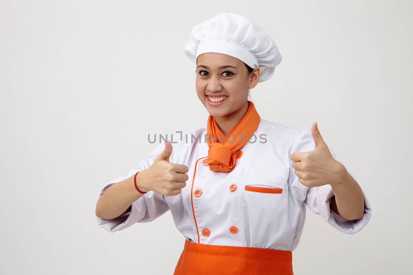Portrait of a Indian woman with chef uniform