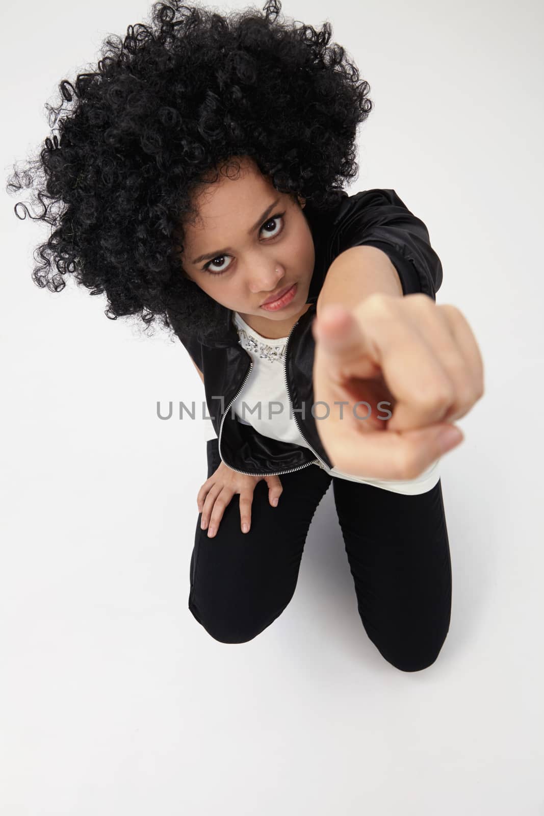 high angle ,indian girl with big afro hair with hand gesture