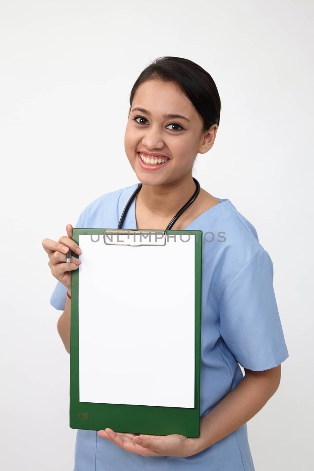 nurse doctor woman smile with stethoscope hold and showing blank clipboard.
