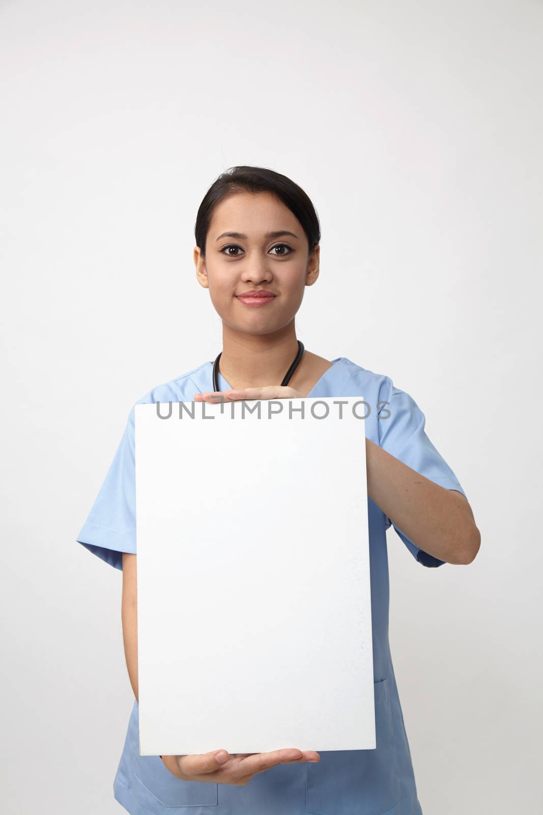 nurse holding placard by eskaylim
