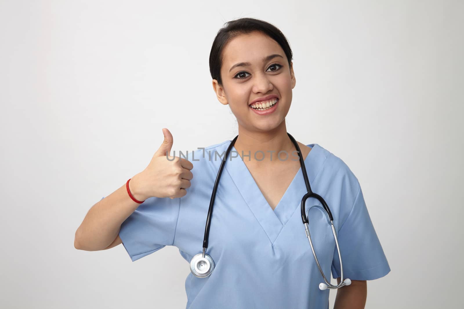 Young Indian medic showing thumbs up