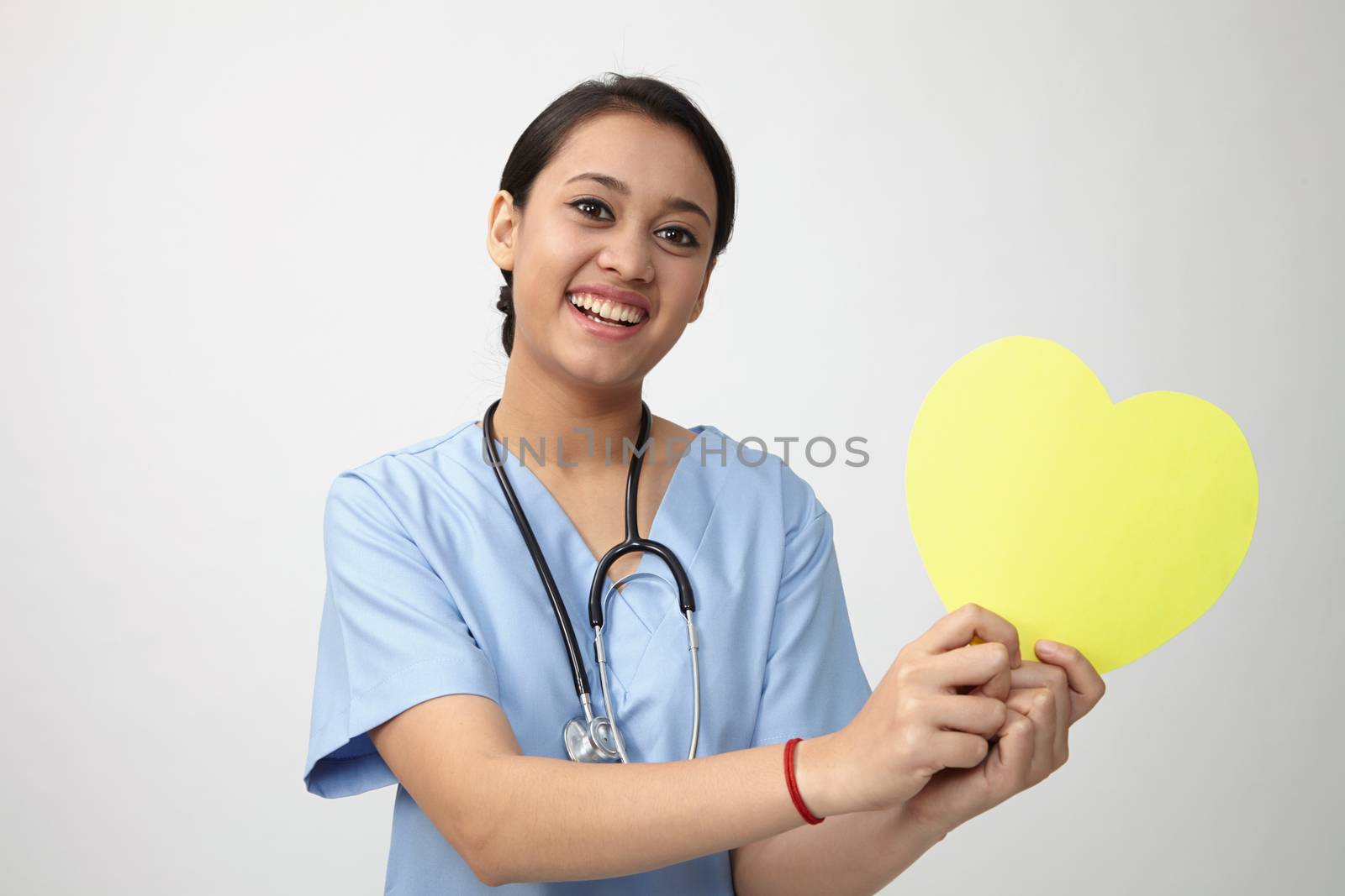 Close up of the nurse holding heart shape