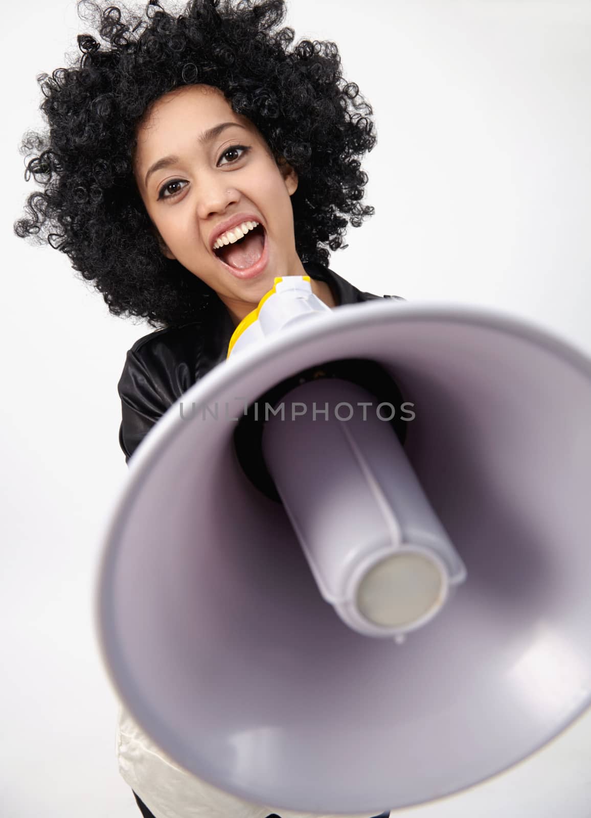 Indian teenage holding a megaphone on the white background