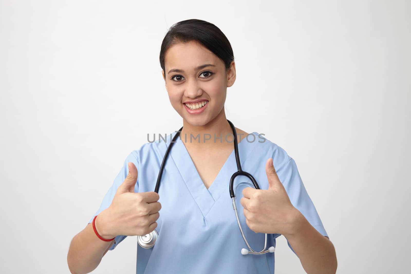 Young Indian medic showing thumbs up