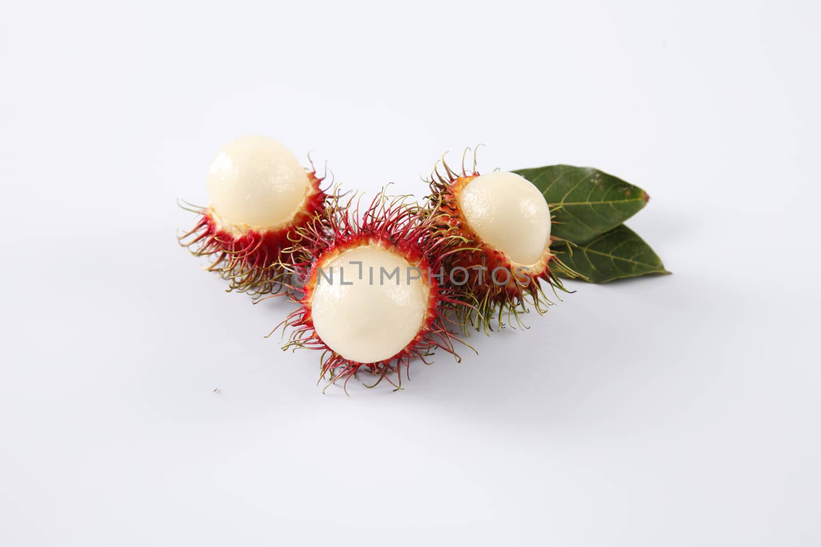 asian fruit rambutan on the plain background