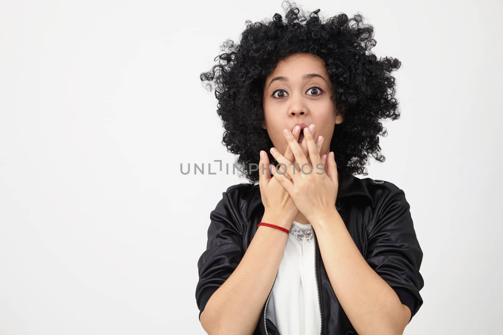 Happy girl with big afro hair with surprise expression