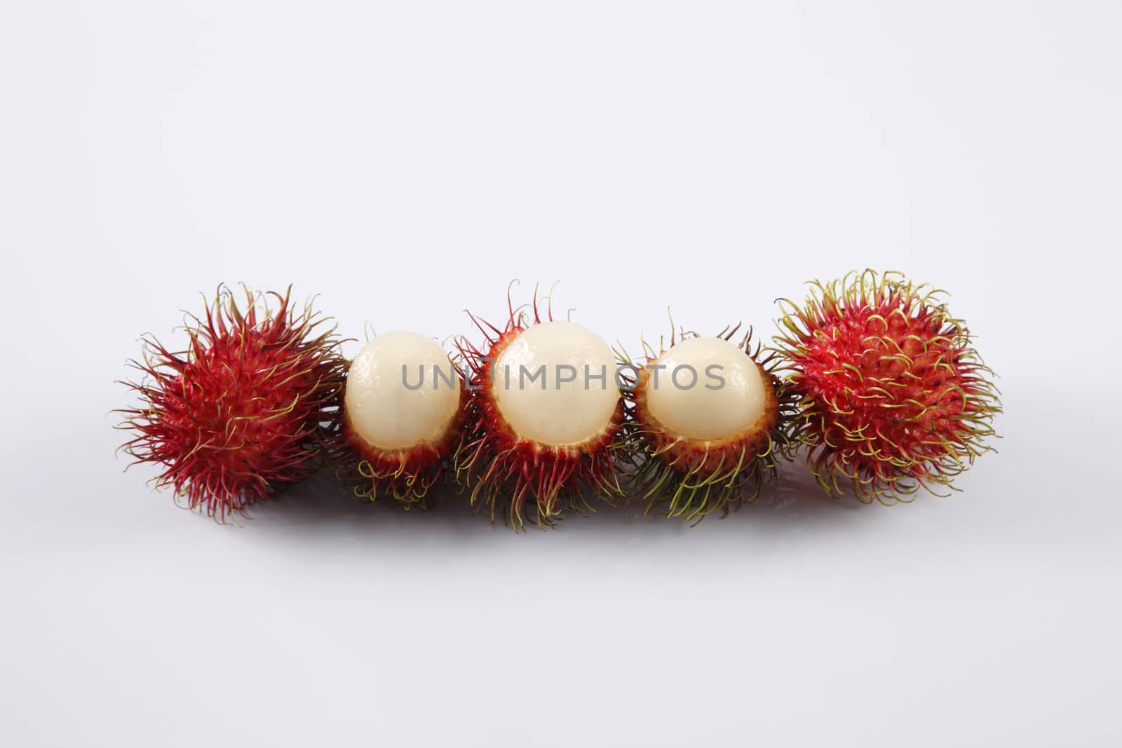 asian fruit rambutan on the plain background