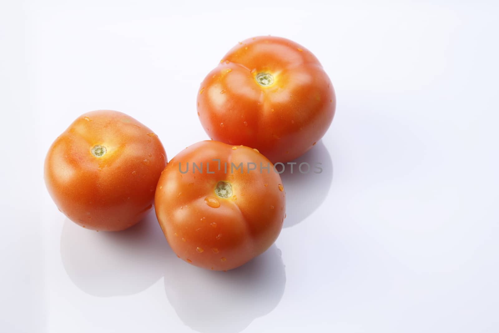 top view of tomatoes on the white backgrond