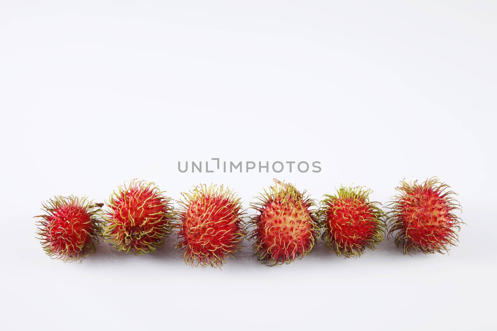 asian fruit rambutan on the plain background