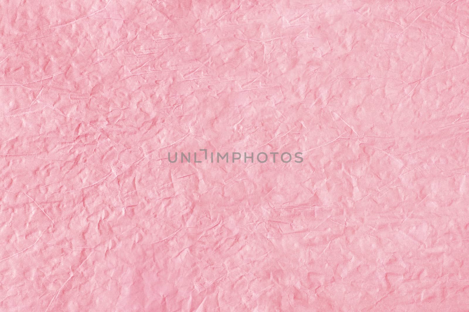 Light pink abstract background from crumpled paper. Crumpled paper texture. Paper wrinkles