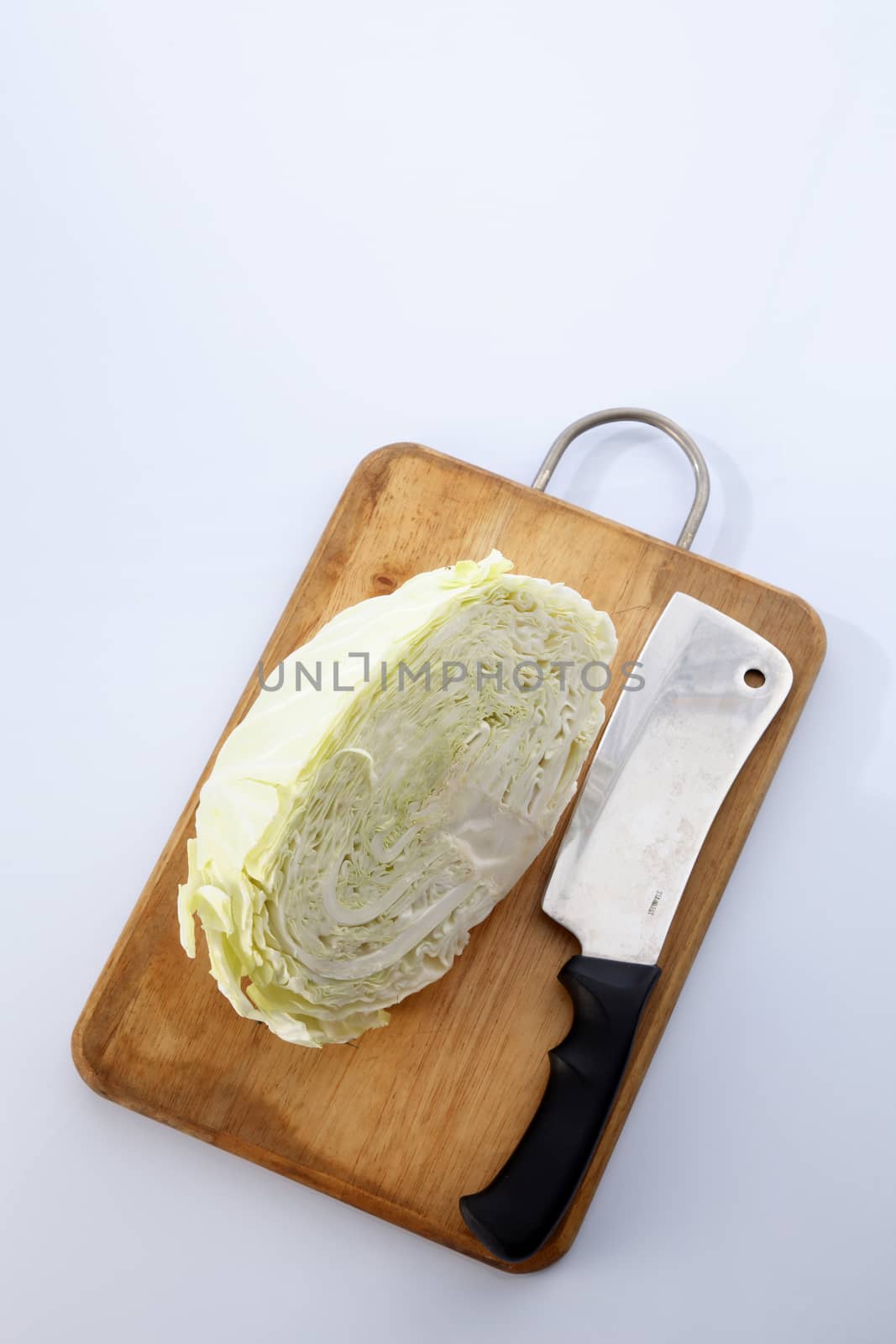 Cabbage cut in half isolated on white background