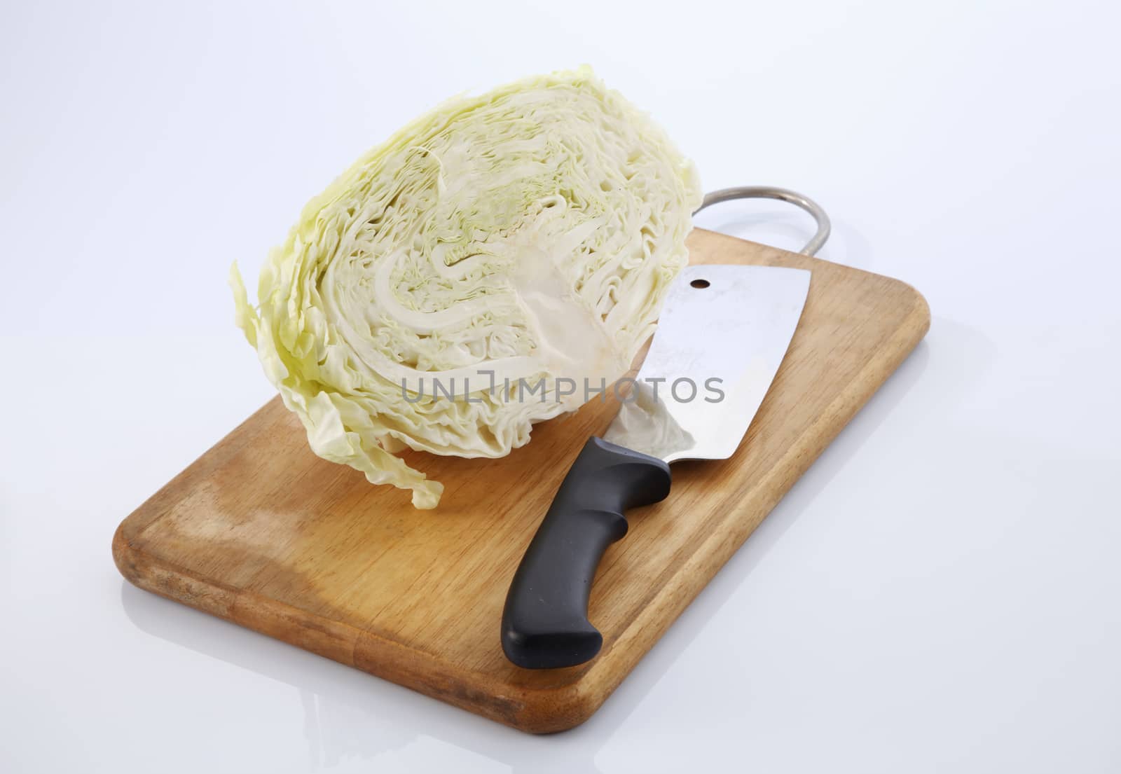 Cabbage cut in half isolated on white background