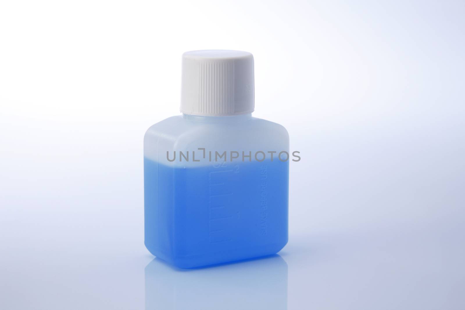 liquid medicine in the plastic bottle