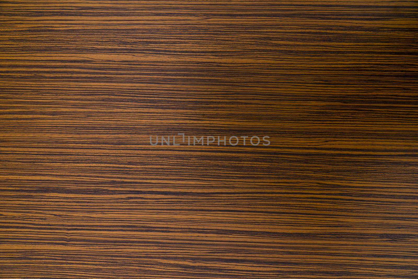 Zebrawood design of brown and black striped color on a laminated table top.