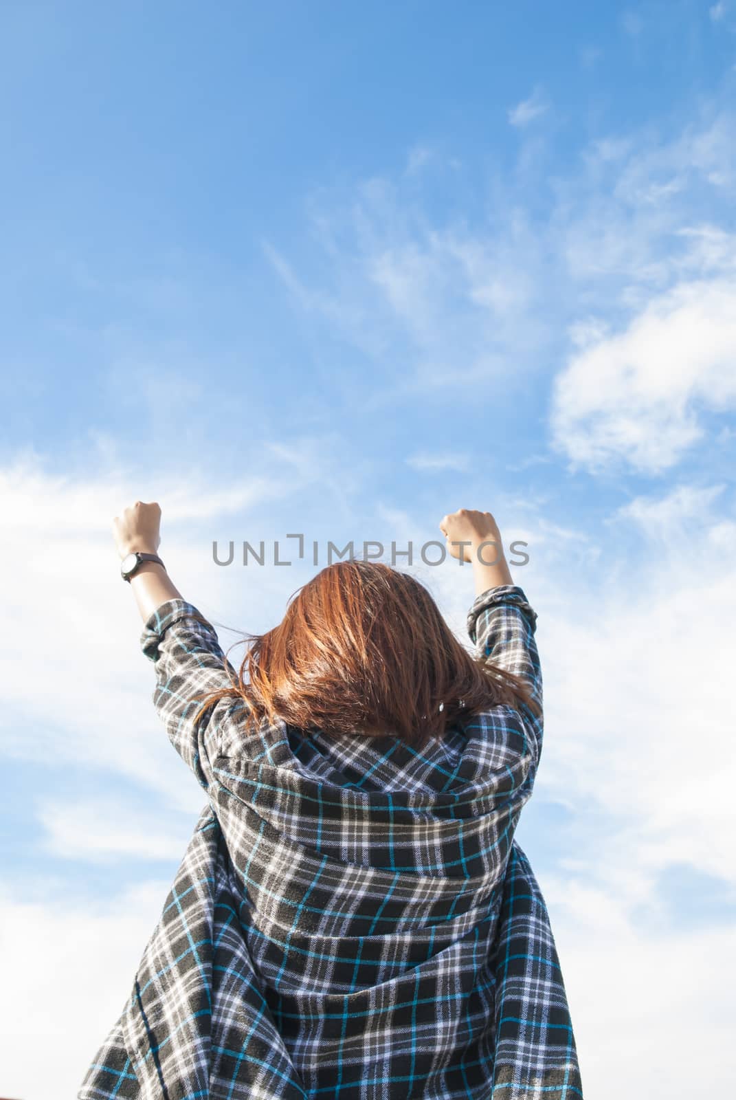 free happy woman raising arms with blue sky by Gobba17