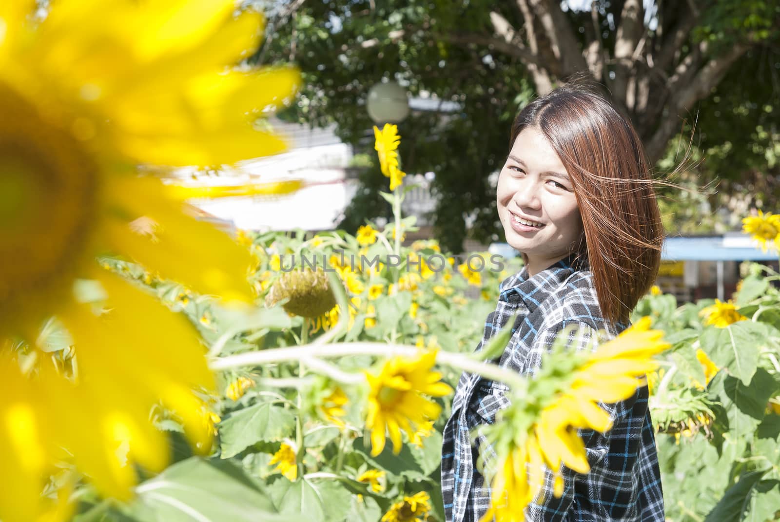 smiling youg woman with sunflower by Gobba17
