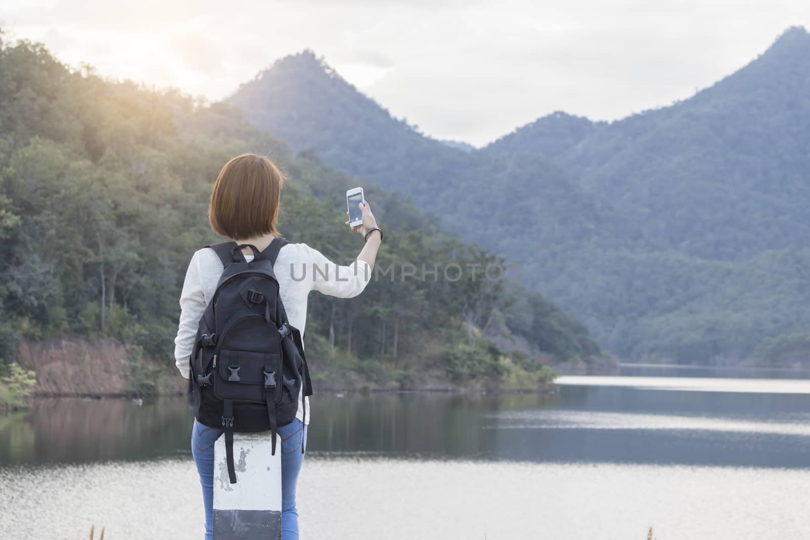 Traveler woman use smart phone taking photo
