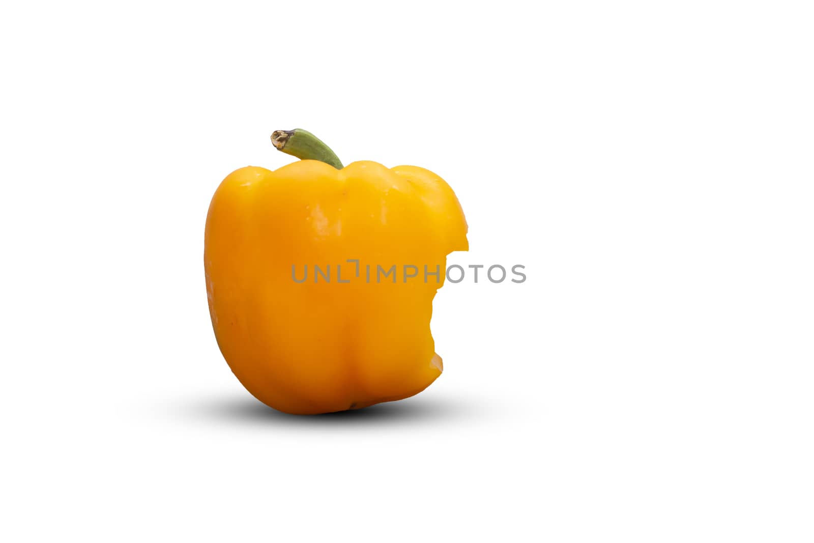 Bite yellow bell pepper  isolated on white background