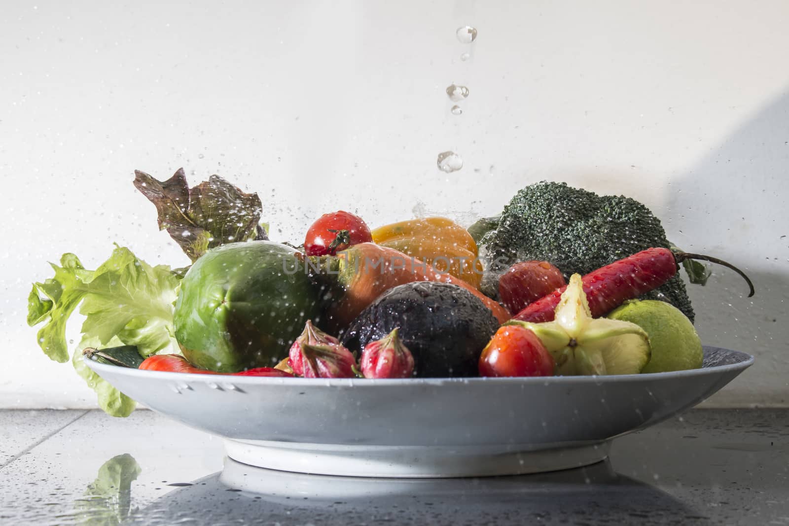 many fresh vegetables falling in water,healthy food