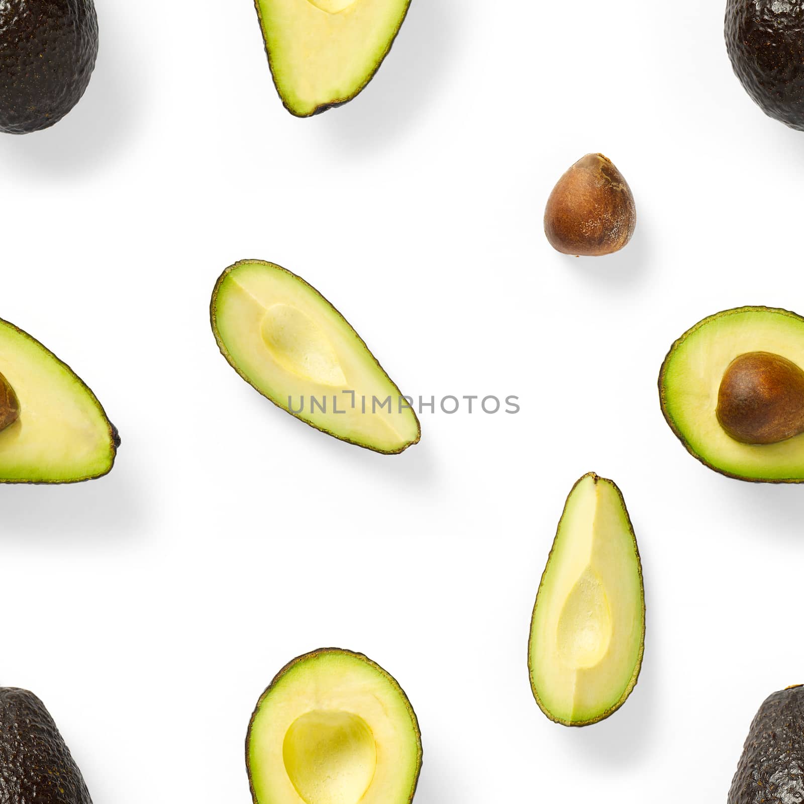 Seamless pattern with avocado slices. Tropical fruit abstract background. Avocado pattern the white background