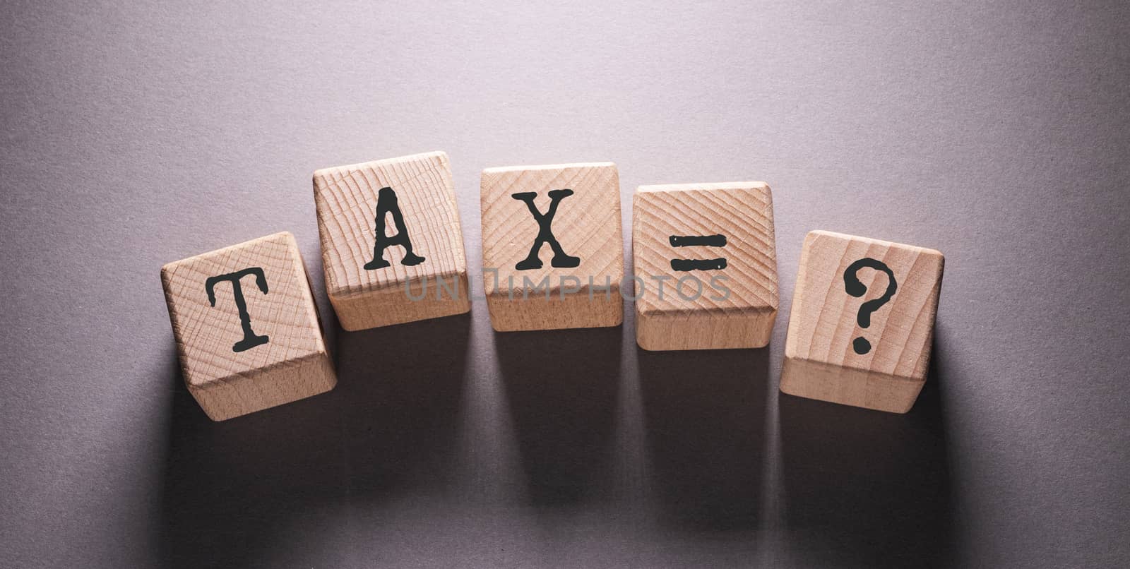 Tax Word with Wooden Cubes by Jievani