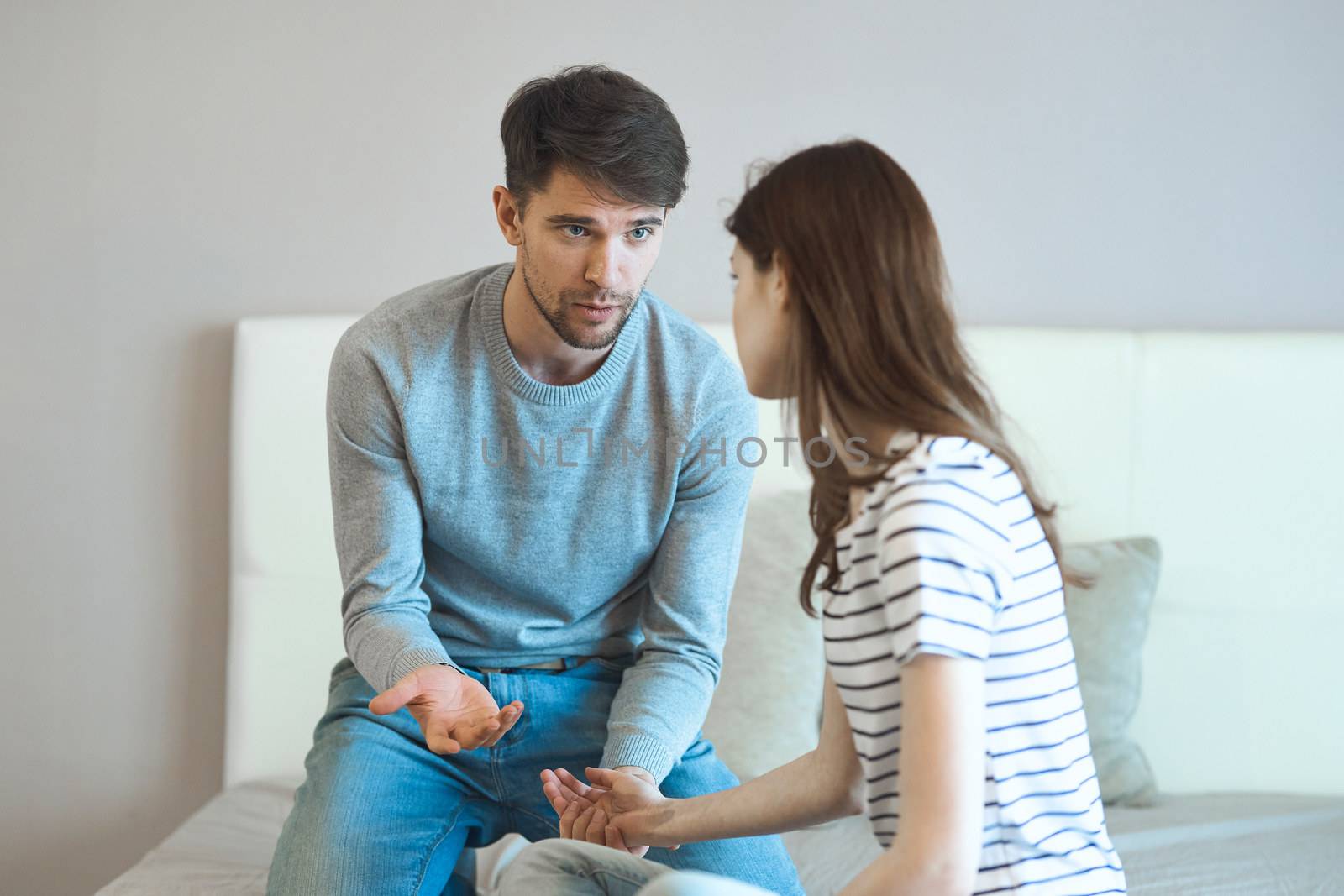 young couple in the bedroom communication discontent conflicts by SHOTPRIME