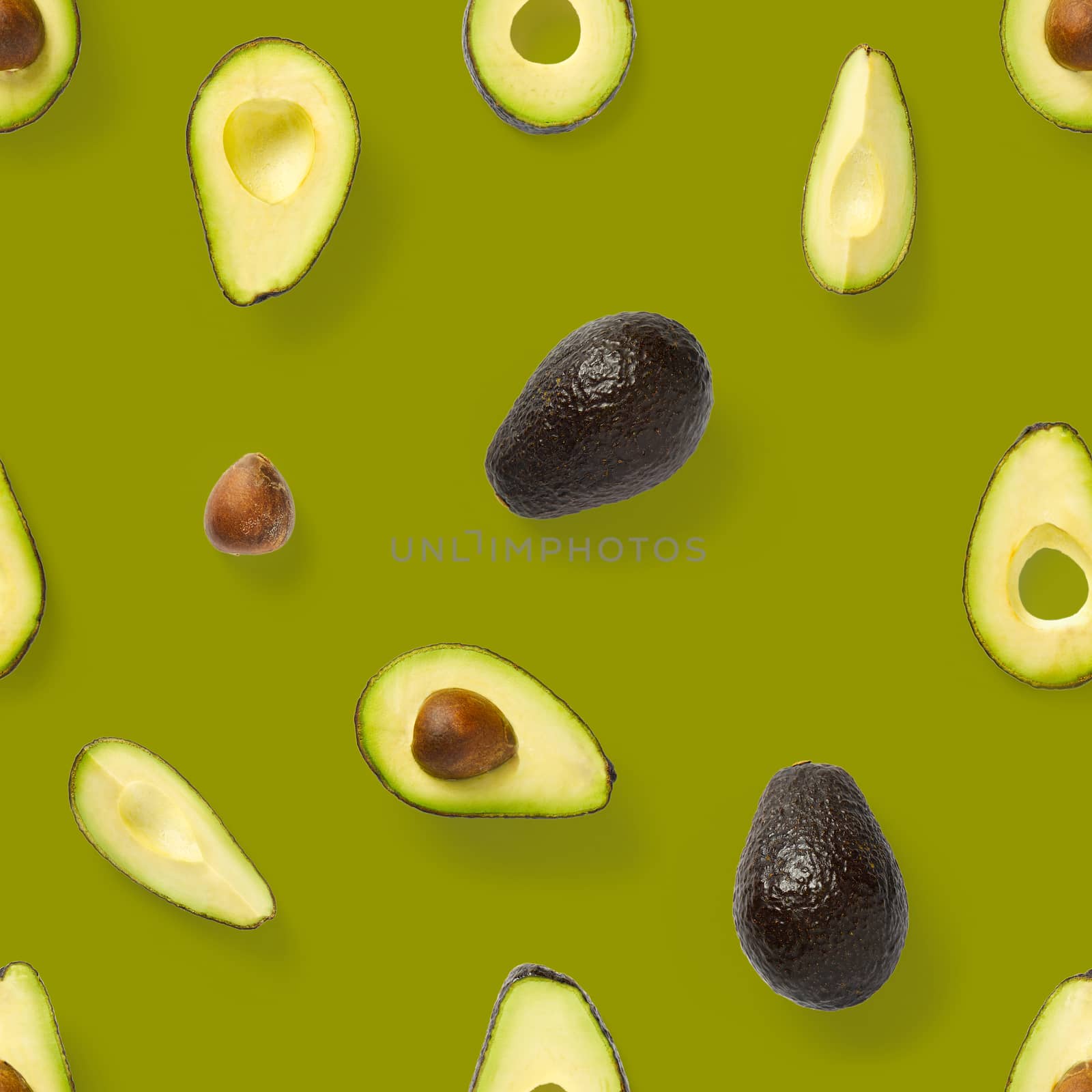 Seamless pattern with avocado slices. Tropical fruit abstract background. Avocado pattern the olive background