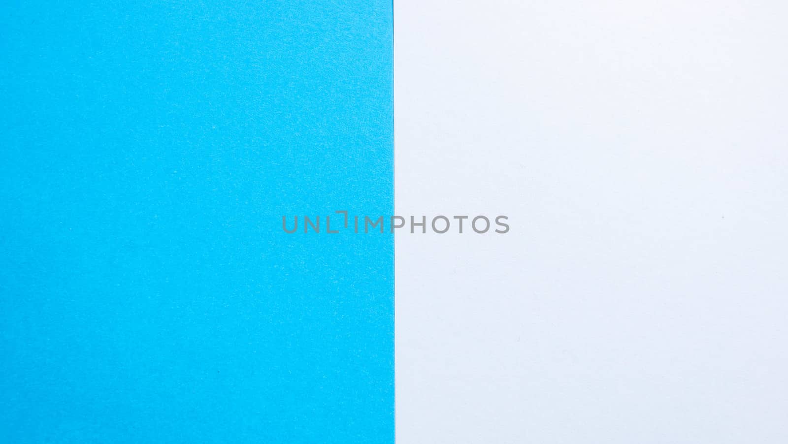 Blue-white matte suede background, close-up. Velvety texture