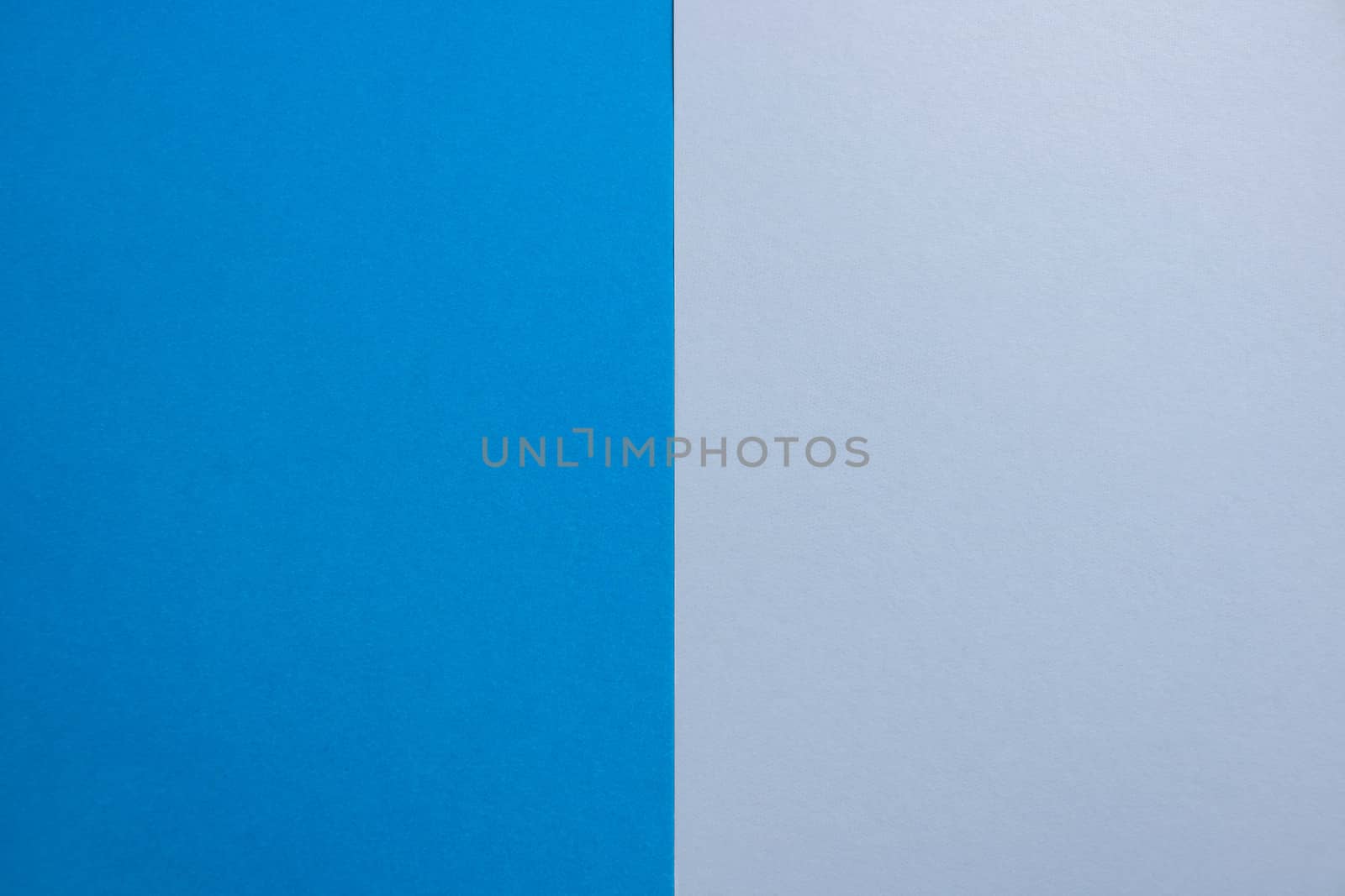 Blue-white matte suede background, close-up. Velvety texture