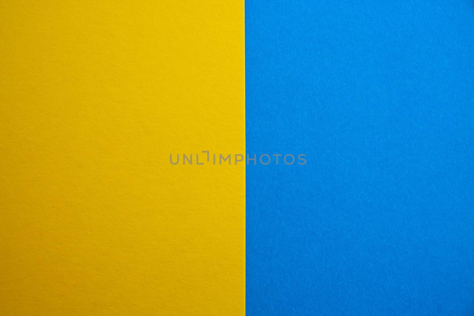blue-yellow matte suede background, close-up. Velvety texture
