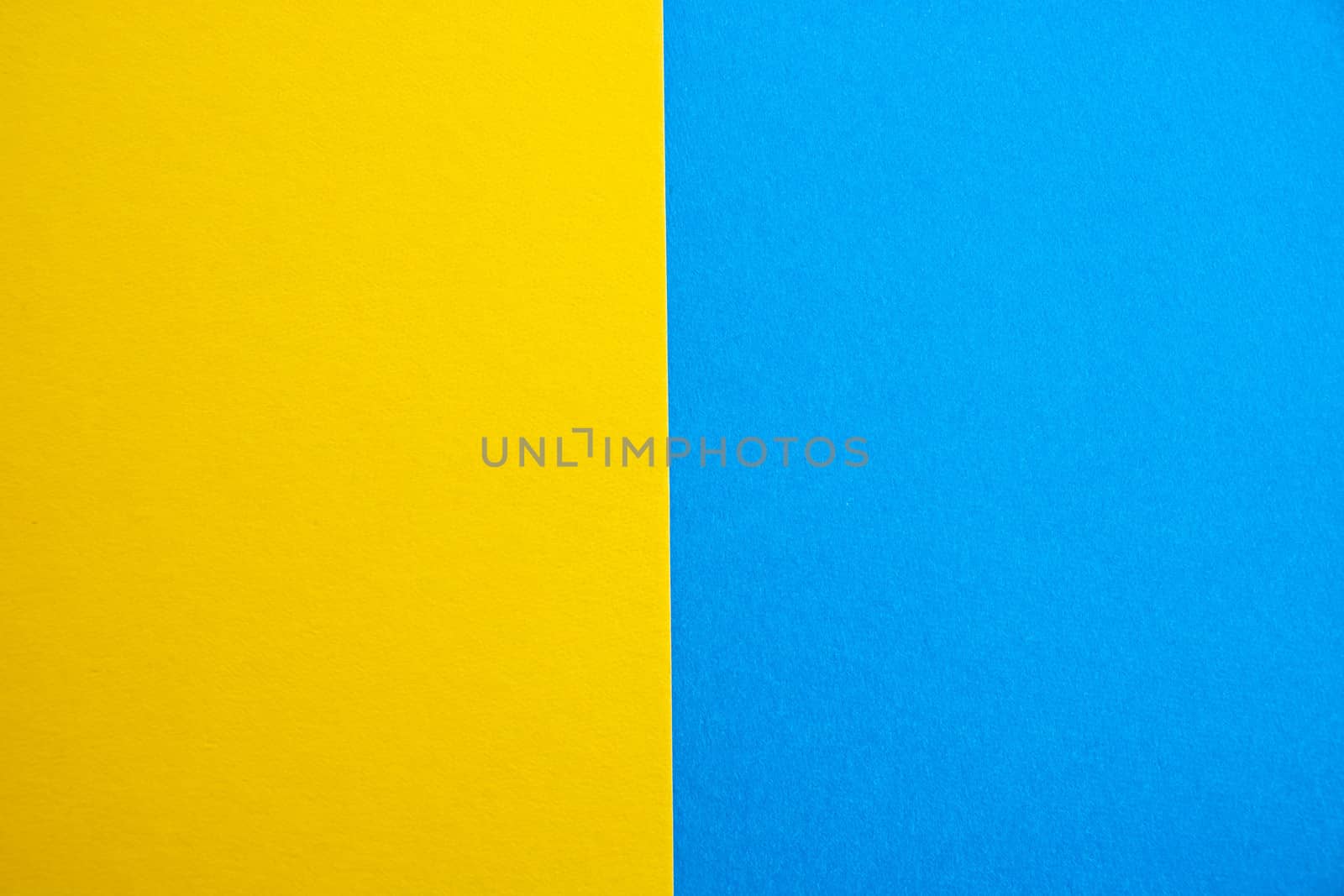 blue-yellow matte suede background, close-up. Velvety texture