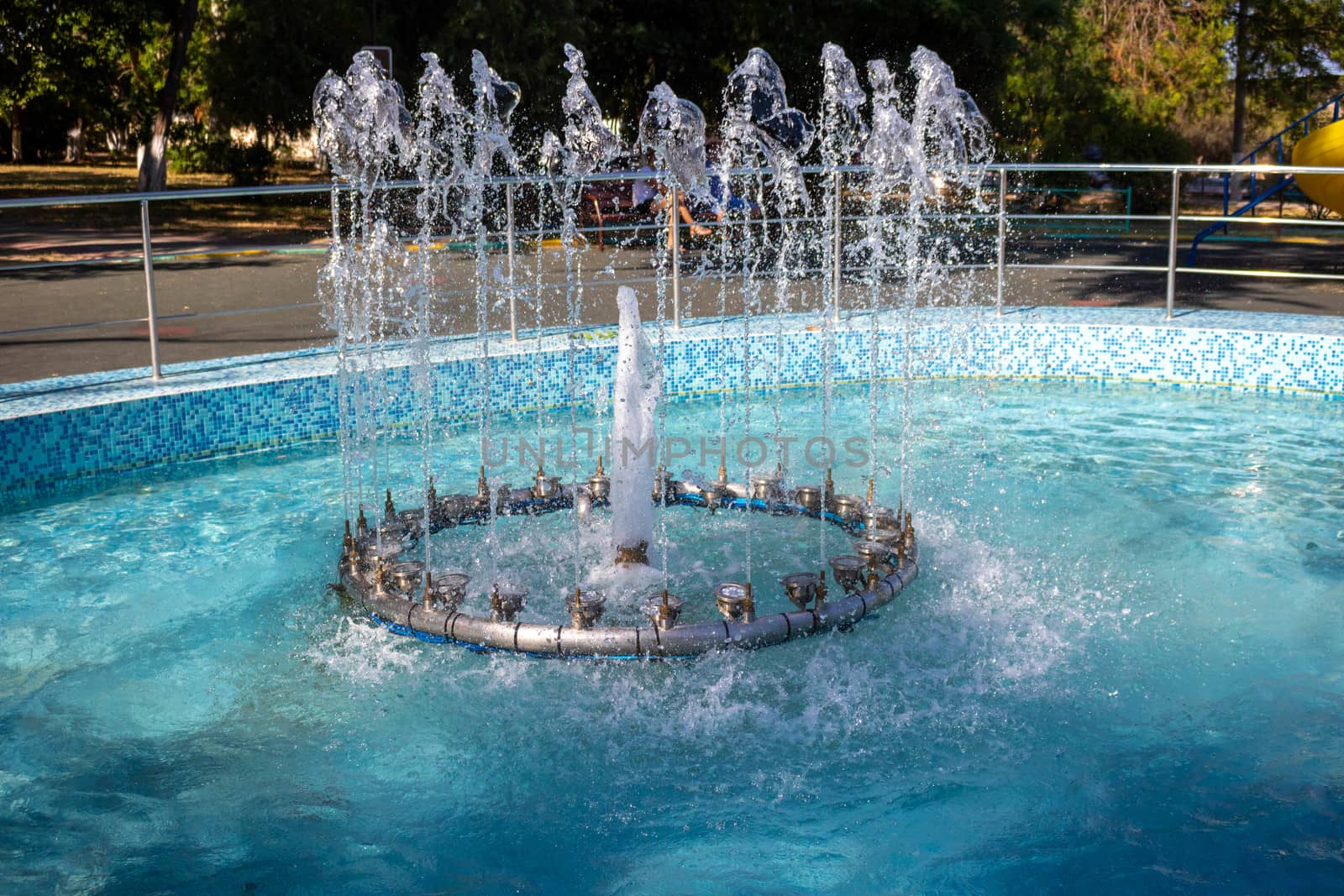 Fountain in the children's Park.Several jets spray up.Sunny day by lapushka62