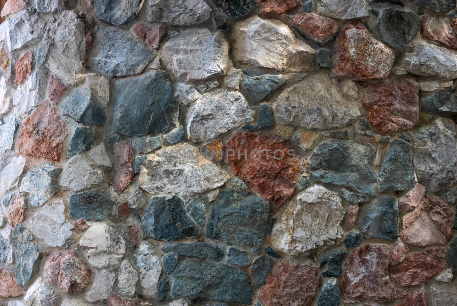 The wall is made of colored stones.Design style wall decor by lapushka62