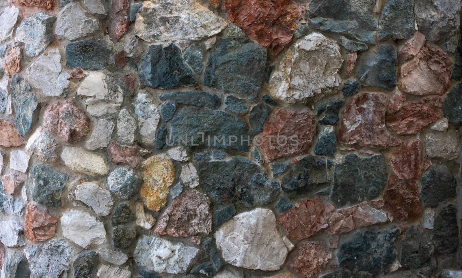 The wall is made of colored stones.Design style wall decor