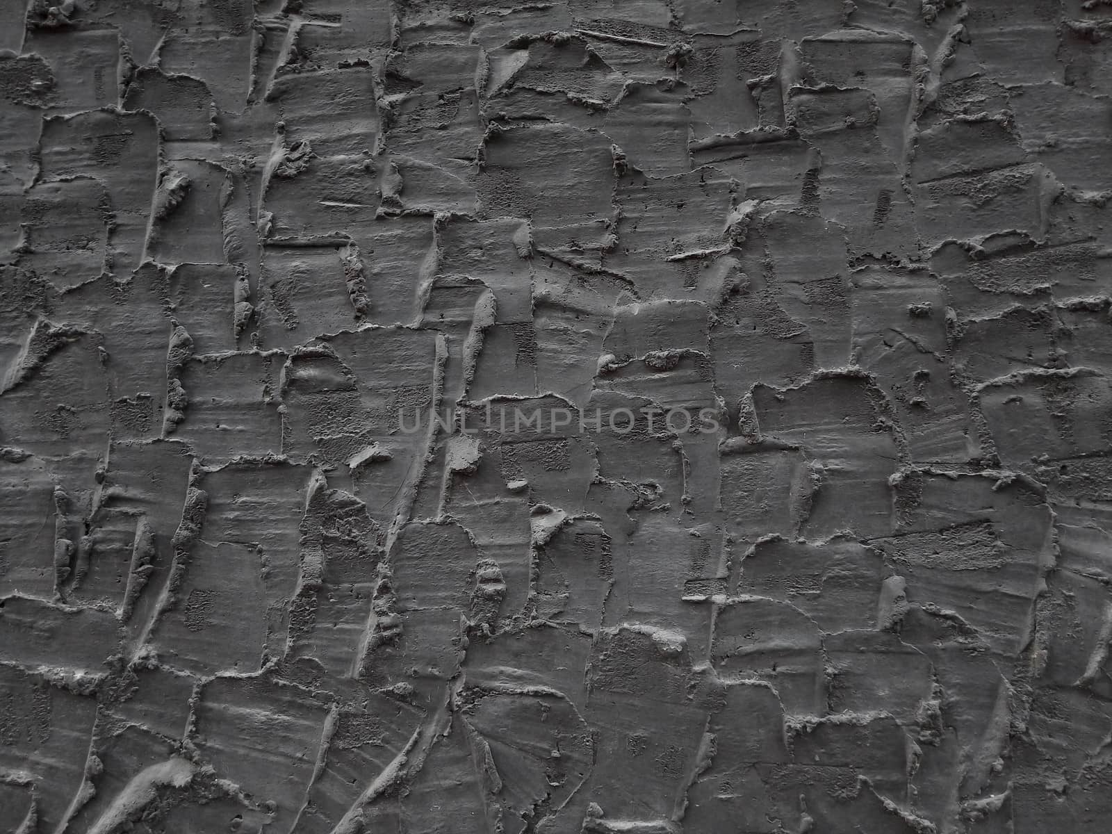 Decorative relief adhesive plaster. Black stucco wall. The black background of the wall. by lapushka62