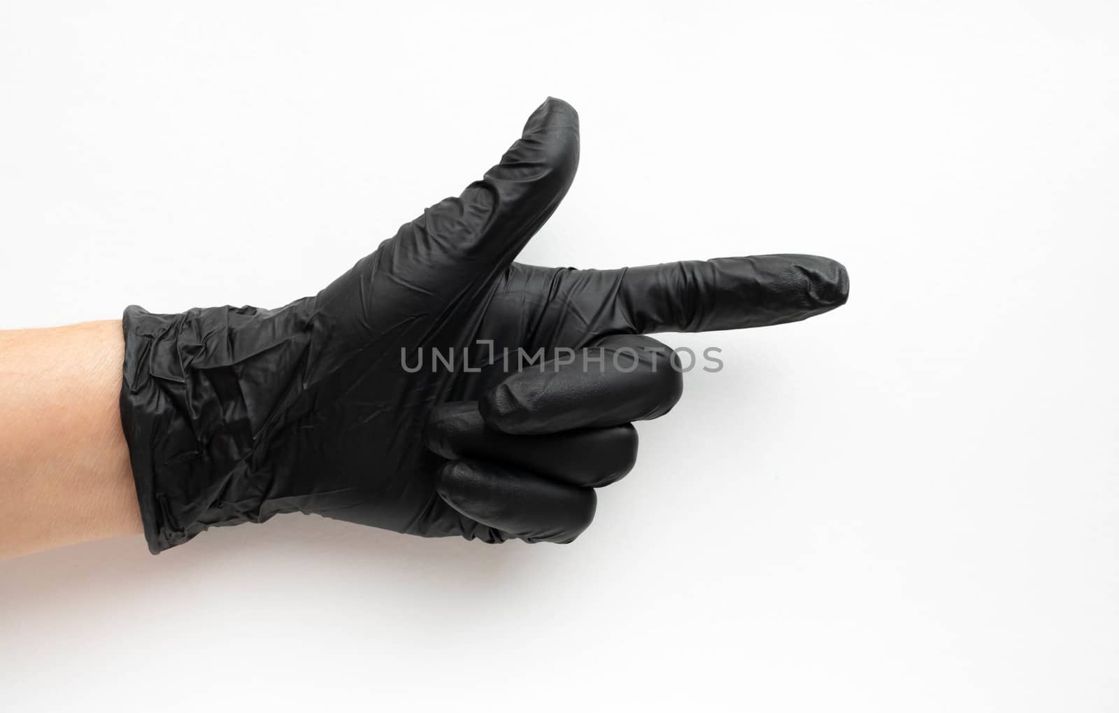 Hand in a black surgical medical glove, isolated on a white background. Production of rubber protective gloves.Hygiene and sanitary standards