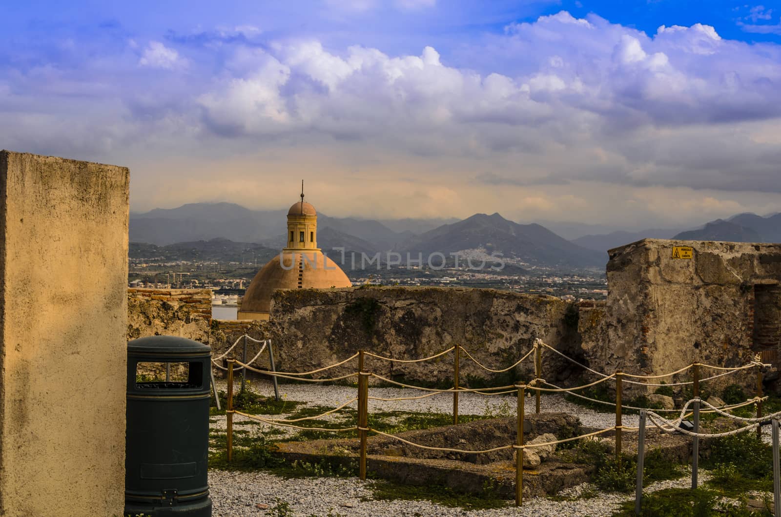 Mountainous landscape of sicily with church dome from the defenses of the norman castle of milazzo