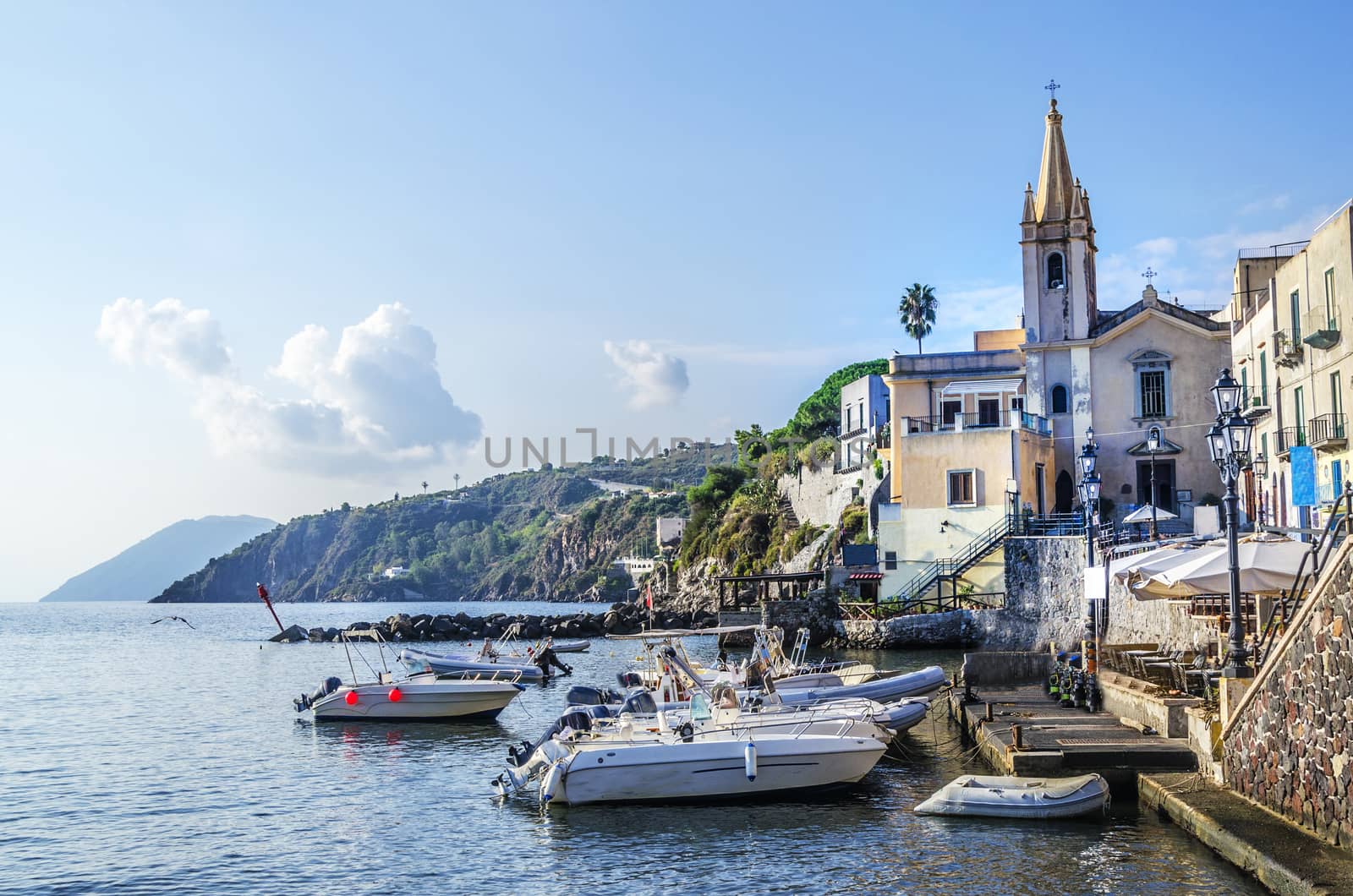 Sports boats are appreciated its berth and the parish of San Giussepe of the year fifteen hundred and forty-five on the island of lipari italy