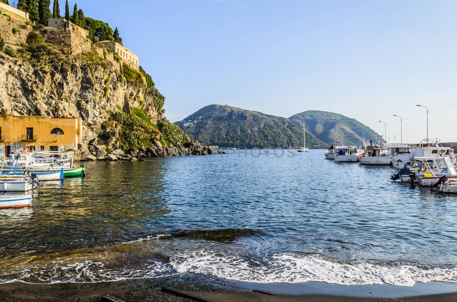 Coast and mooring of fishing boats and stroll on the Tyrrhenian Sea on the eolian  island of  lipari