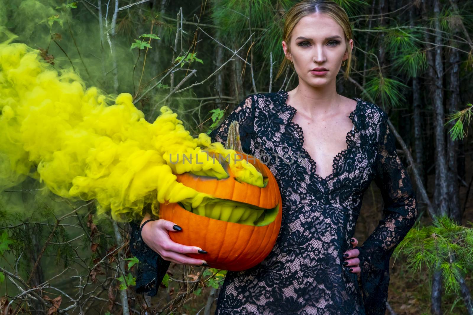 Blonde Model Posing With A Smoking Pumpkin by actionsports