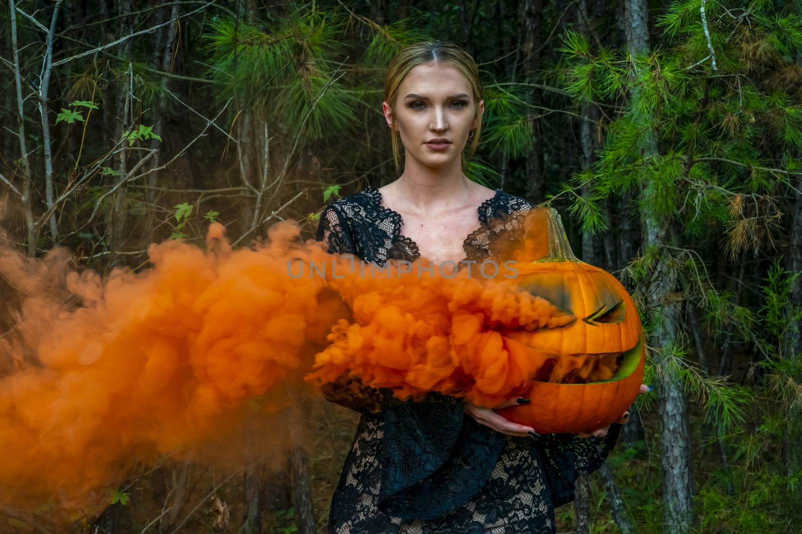 Blonde Model Posing With A Smoking Pumpkin by actionsports