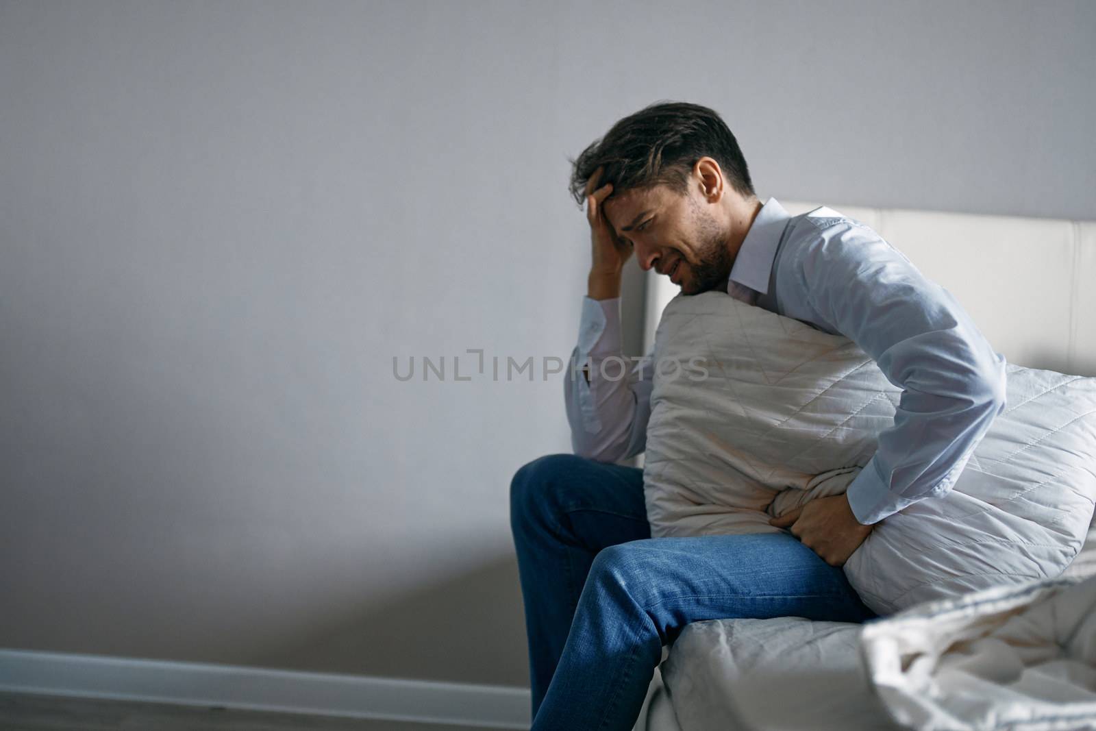 man sleeping on the couch depression disorder insomnia bad mood