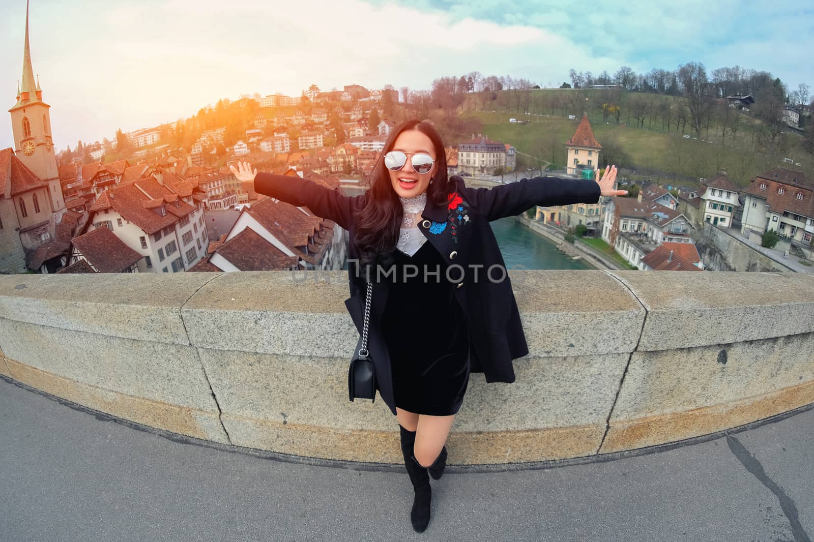 Young Woman Tourists selfie with mobile phone near old town in Bern at Switzerland

