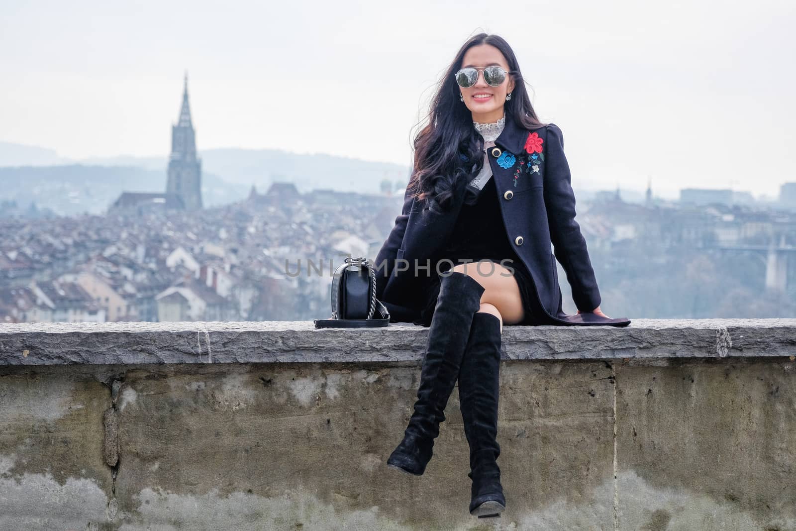 Young Beautiful Woman Tourists in view point near old town in Bern, Switzerland

